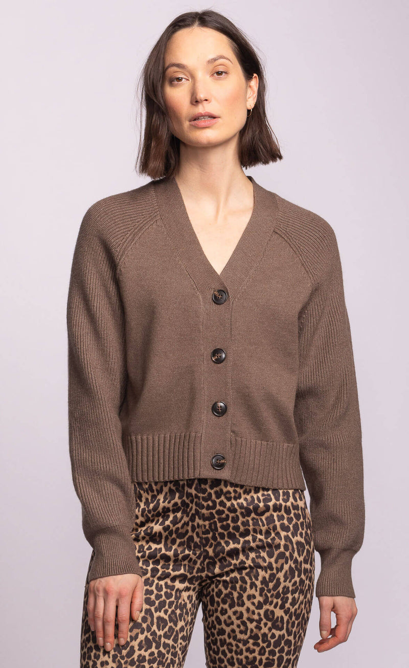 Model wearing the Lemonberry Monterey Sweater in neutral taupe, button-front cardigan with cropped fit and ribbed hem.