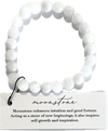 White beaded bracelet on a card with moonstone information