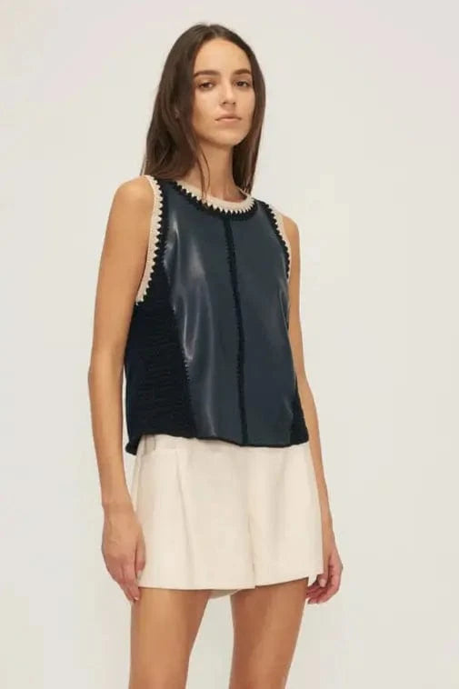 Front of the Melissa Nepton Naru tank, paired with white shorts.