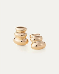 Full view of Non-Stop Earrings with curved sculptural shape — high-polish gold finish