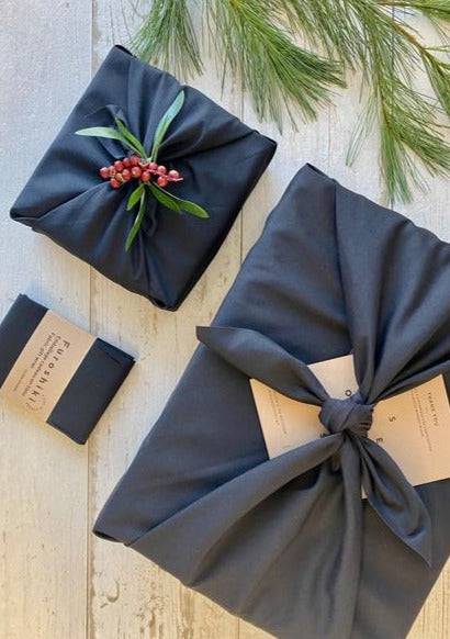 Olsen + Olsen Furoshiki wrap in navy with greenery accent – giftable holiday style near Kleinburg Village.