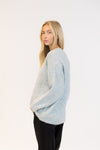 Relaxed profile in cozy crewneck sweater, soft blue marl tone
