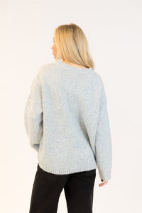 Back view of Lyla & Luxe Opal sweater showing ribbed neckline and relaxed fit