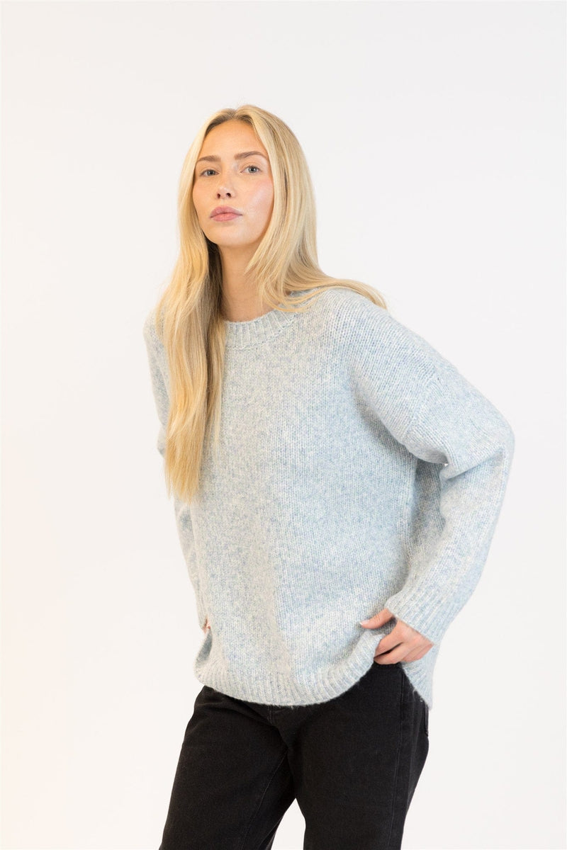 Lyla & Luxe Opal crewneck sweater in blue/green marl, styled with black jeans