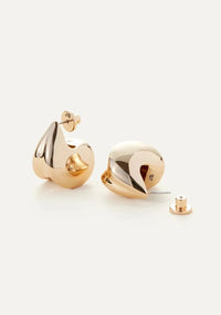 Paige Puff Earrings by Jenny Bird, sitting on a white background, displaying their gold detail and shape.