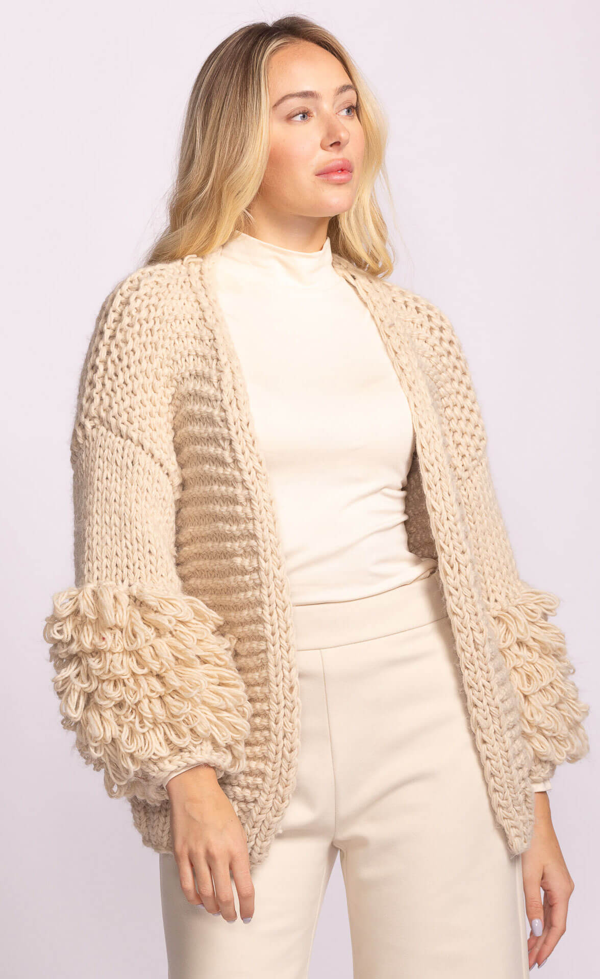 Palermo Sweater in cream by Pink Martini, open-front style with statement sleeves – shop Lemonberry Aurora or online with Canada-wide delivery.