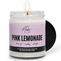 Pink Lemonade candle by Market Candle Company, lit and close up at Lemonberry clothing boutique.