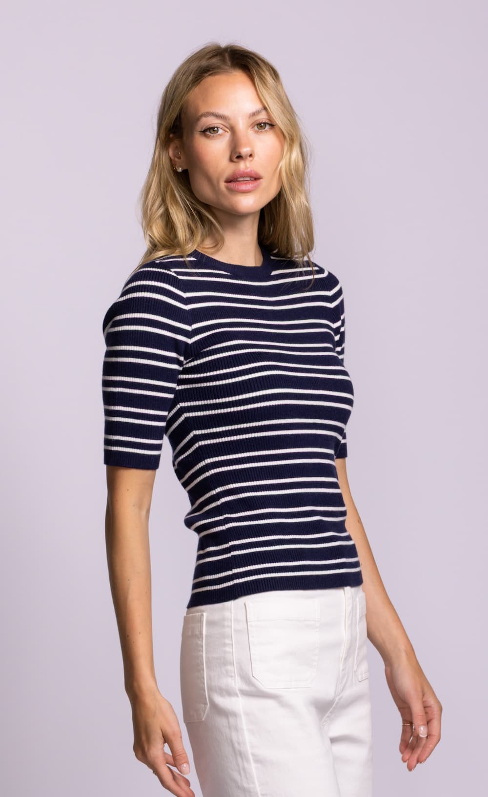 Side view of Pink Martini Acama navy striped short sleeve rib knit sweater.