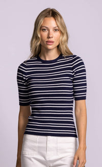 Pink Martini Acama sweater in navy with white stripe, short sleeve ribbed knit fitted top styled with white trousers at Lemonberry Aurora.