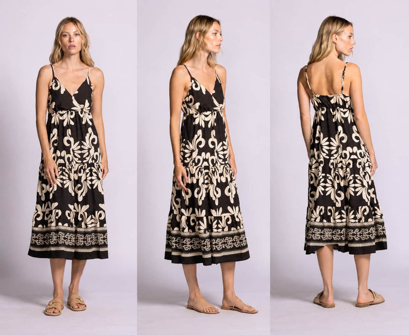 Woman wearing Pink Martini Archwood dress in black from front, side, and back views on a light gray background for Lemonberry in Aurora, Ontario.