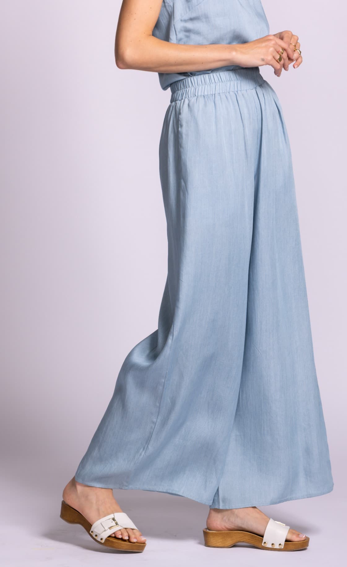 Side view of Pink Martini Dash blue wide-leg pants with flowy lightweight fabric