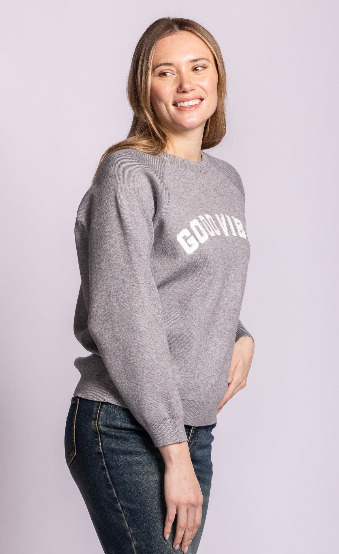 Pink Martini Good Vibes grey sweater, angled-front view