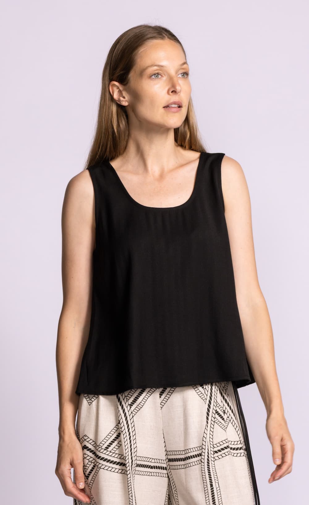 Pink Martini Jennifer black swing tank relaxed fit model angle Lemonberry Aurora