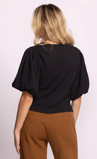 Back view of Pink Martini Lita Top in black with puff sleeves.