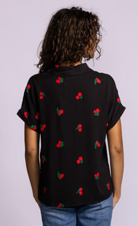 Back view of Pink Martini Mon Cherry blouse in black with allover embroidered cherry detail.