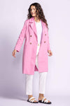 Pink Martini pink trench jacket styled with white pants and sandals — lightweight spring outerwear