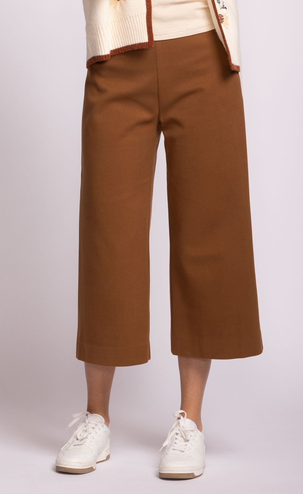 Front view of Nadia Pant in camel, showing tailored waistband and pockets
