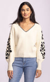 Back view of Pink Martini Pavia Sweater in cream with black floral embroidered statement sleeves – available at Lemonberry Toronto.