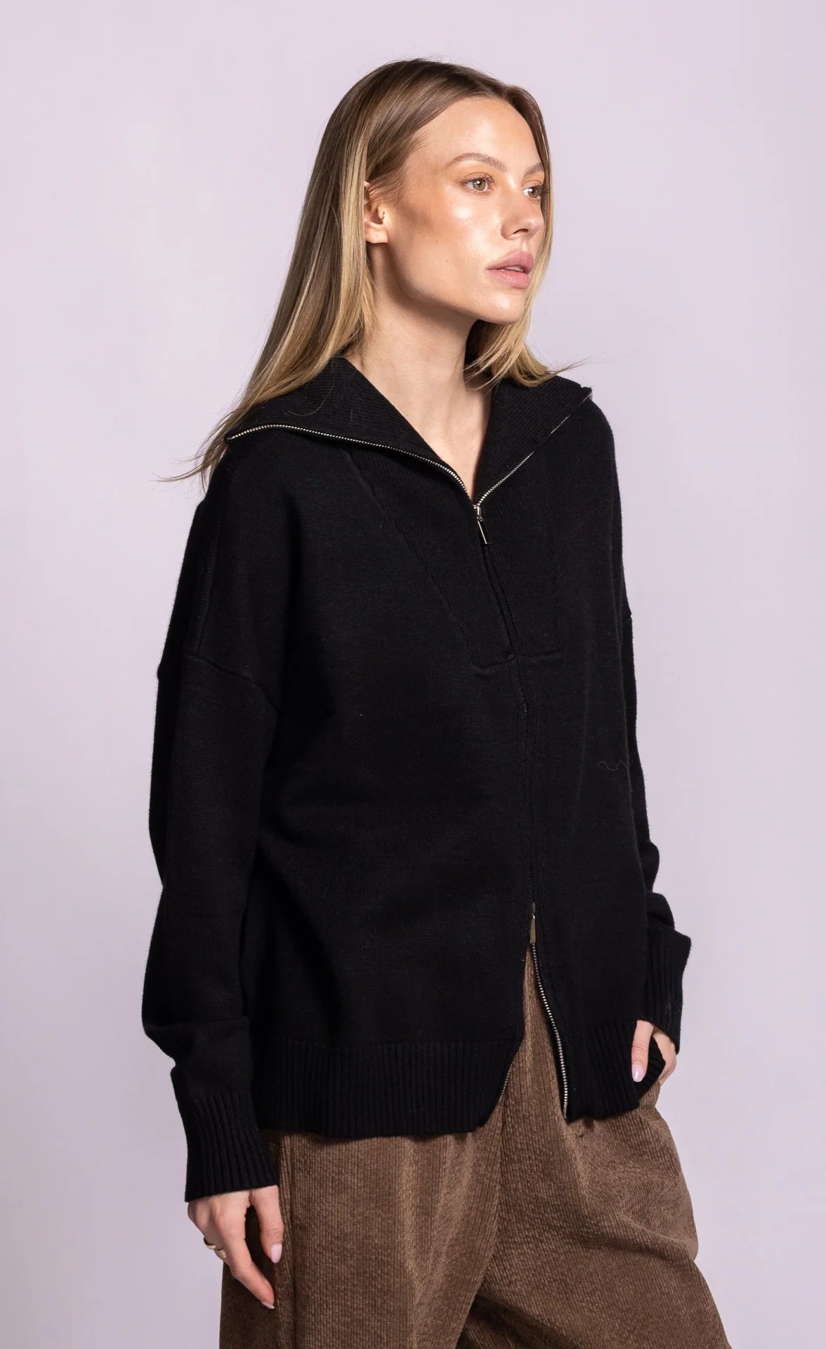 Pink Martini Perry black cardigan, angled-front view showing dropped shoulders