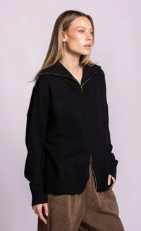 Pink Martini Perry black cardigan, angled-front view showing dropped shoulders