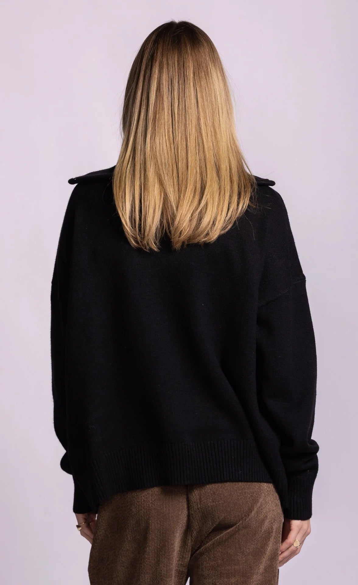 Pink Martini Perry black cardigan, back view with ribbed hem