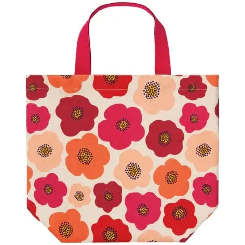 Flat lay of Danica Poppy Pocket Tote with red and pink floral design.