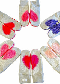 Preloved Ariel Mitts in assorted colours — Canadian-made fleece mittens with upcycled wool heart patches, photographed in a circle layout.