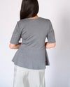 grey ponte knit peplum top back view with upcycled heart patch Preloved Lemonberry Aurora worn