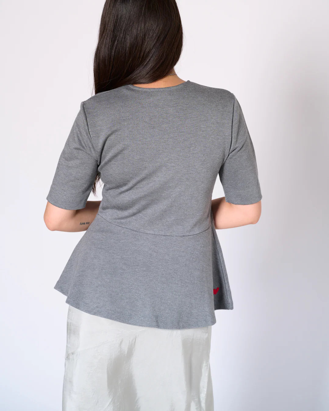 grey ponte knit peplum top back view with upcycled heart patch Preloved Lemonberry Aurora worn