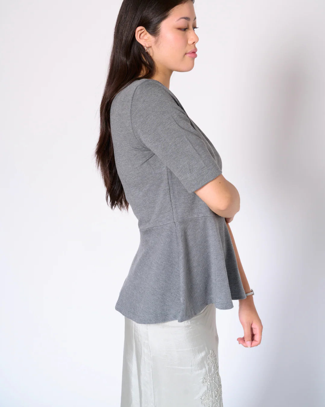 grey ponte knit peplum top side view Preloved with heart detail Lemonberry Aurora worn
