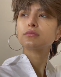 video of Icon hoops in medium by Jenny Bird, word by a model