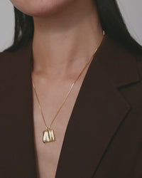 Jenny Bird Sundra Small Pendant Necklace in motion — gold pendant shimmer video, Lemonberry Aurora.