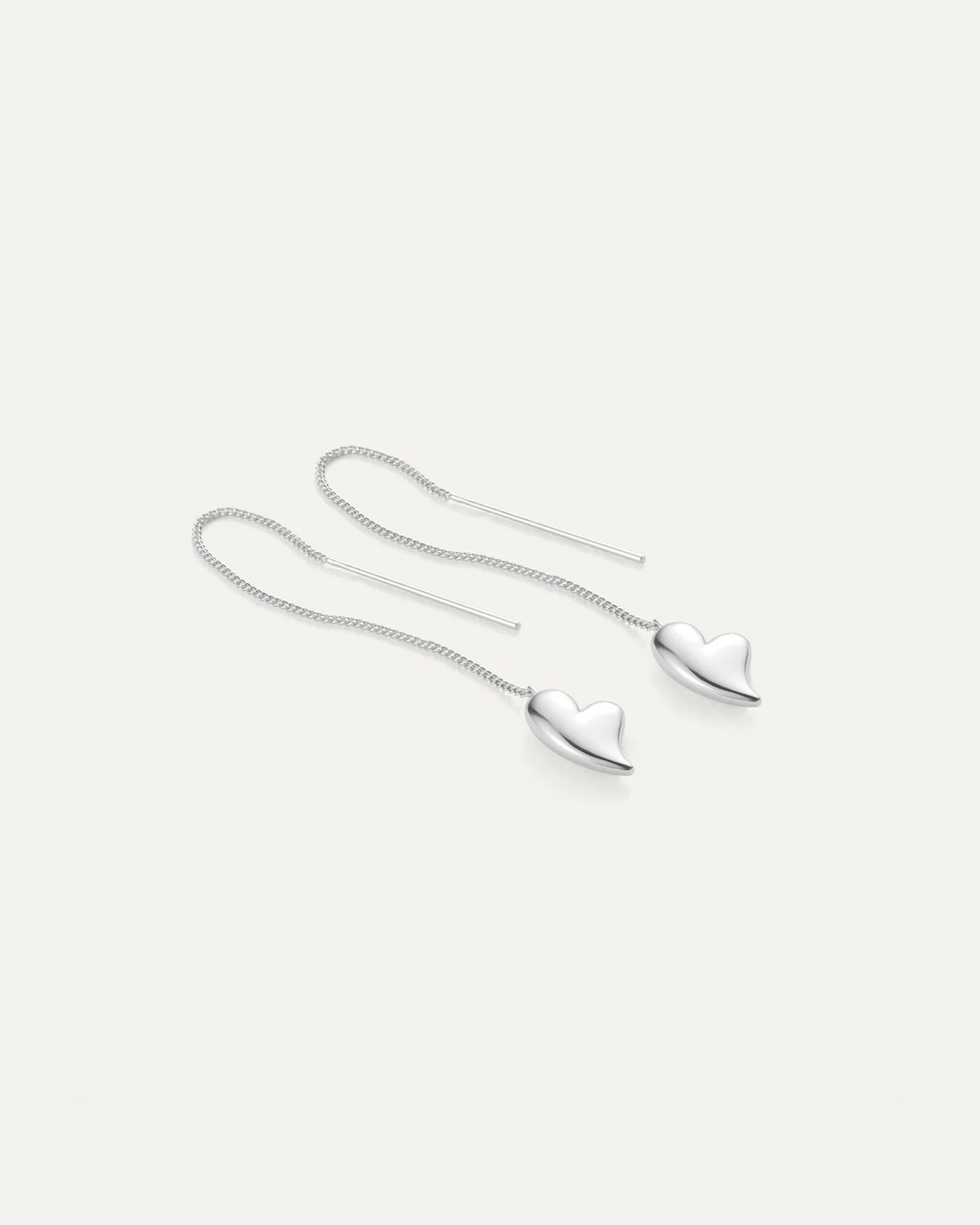 Silver puffy heart threader earrings pair laid flat, Jenny Bird — Lemonberry Aurora