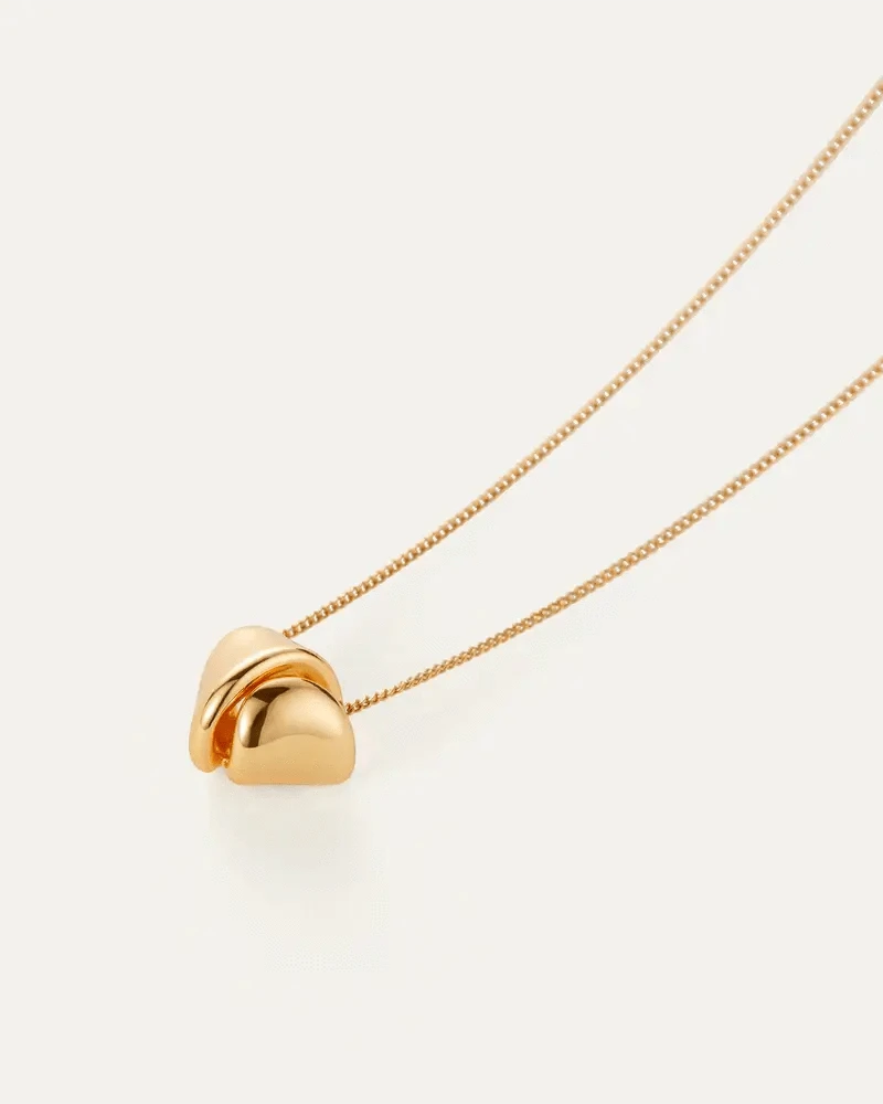Folded metal detail on the Rio Pendant Necklace by Jenny Bird — high-polish gold finish available online at Lemonberry