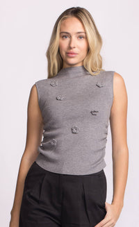 Front view of grey Rosslie knit top with floral appliqués and modern sleeveless cut.