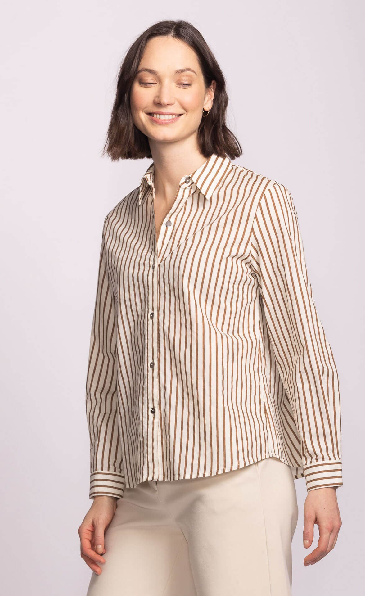 Side view of Sapphire Top styled casually with neutral trousers