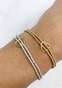 Saskia De Vries Jewelry Double Love Gold Leave-On available at Lemonberry Boutique Aurora