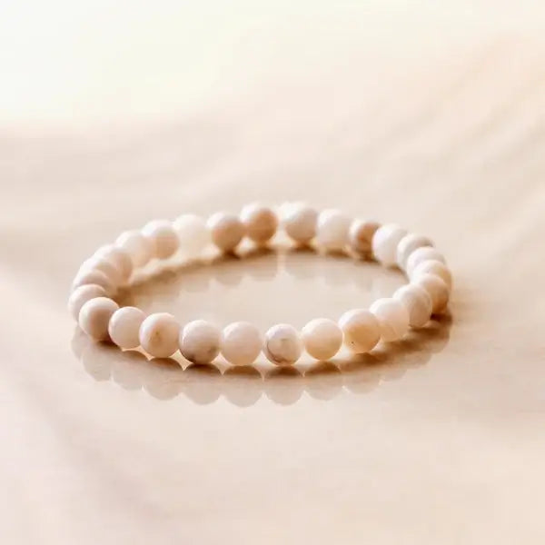 Cream Crazy Lace Agate bracelet by Shiny Soul Creations on polished surface, soft ivory tones
