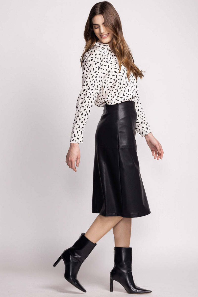 Side view of the Peyton Skirt, worn by a model with a  blouse and heels at Lemonberry Aurora, ON