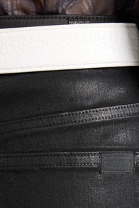 The Slim coated black jeans detail