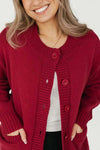 Close-up front view of the Smash + Tess Big Heart Cardigan in red, showcasing its soft knit texture, button details, and front pockets. Available at Lemonberry, Aurora, ON