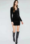 Model wearing the Sonoma Dress by Gentle Fawn in black, paired with knee high black boots.