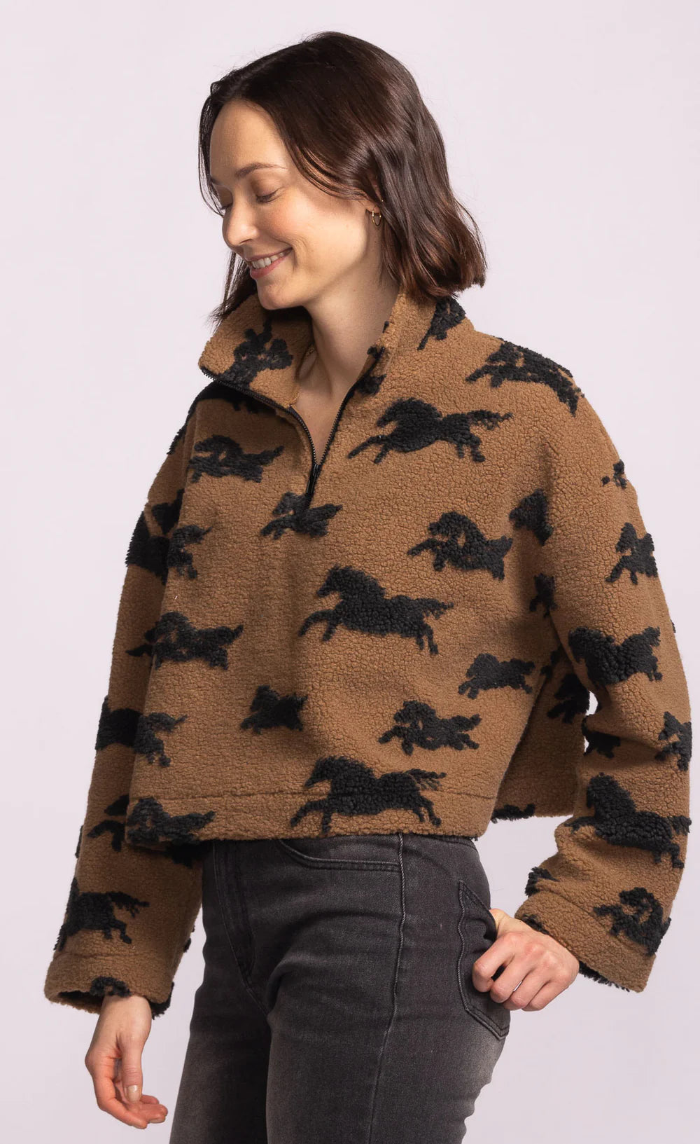 Side view of Spirit Jacket showing cropped hem and rustic horse jacquard print