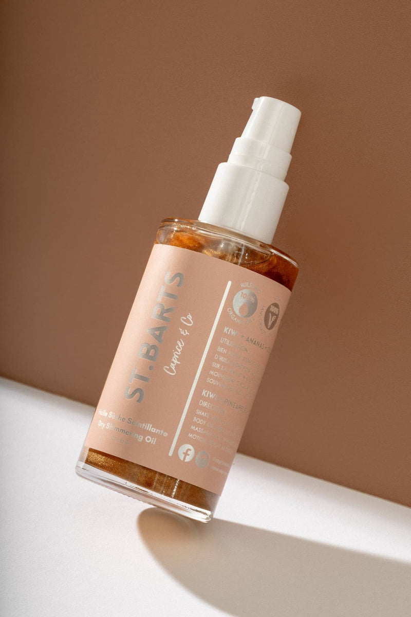 Full bottle of St. Barts dry shimmering oil in bronze with pump applicator.