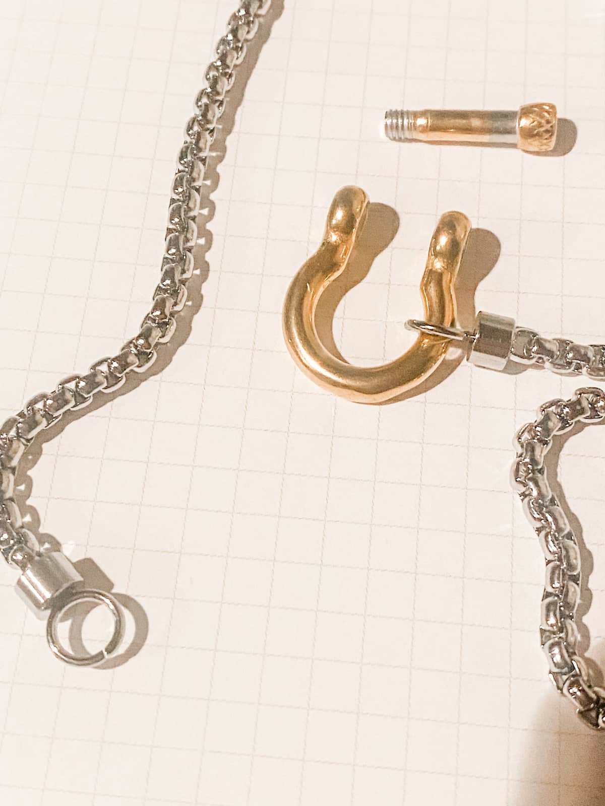 Open gold carabiner clasp with silver stainless steel chain detail Lemonberry Aurora