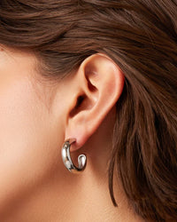 Silver Jenny Bird Staple Hoops medium size — worn on model ear, Lemonberry Aurora detail