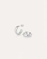 Staple Hoops Medium Earrings in silver resting on white table by Jenny Bird, available near Newmarket and Bradford at Lemonberry.