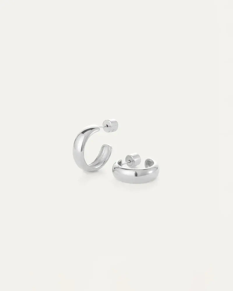 Staple Hoops Medium Earrings in silver resting on white table by Jenny Bird, available near Newmarket and Bradford at Lemonberry.