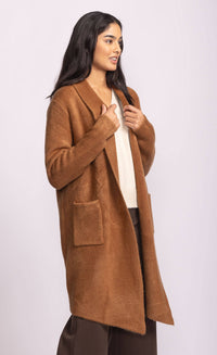 Urban-styled outfit featuring the Stockport Jacket in copper, styled casually for fall in a Toronto alley backdrop.