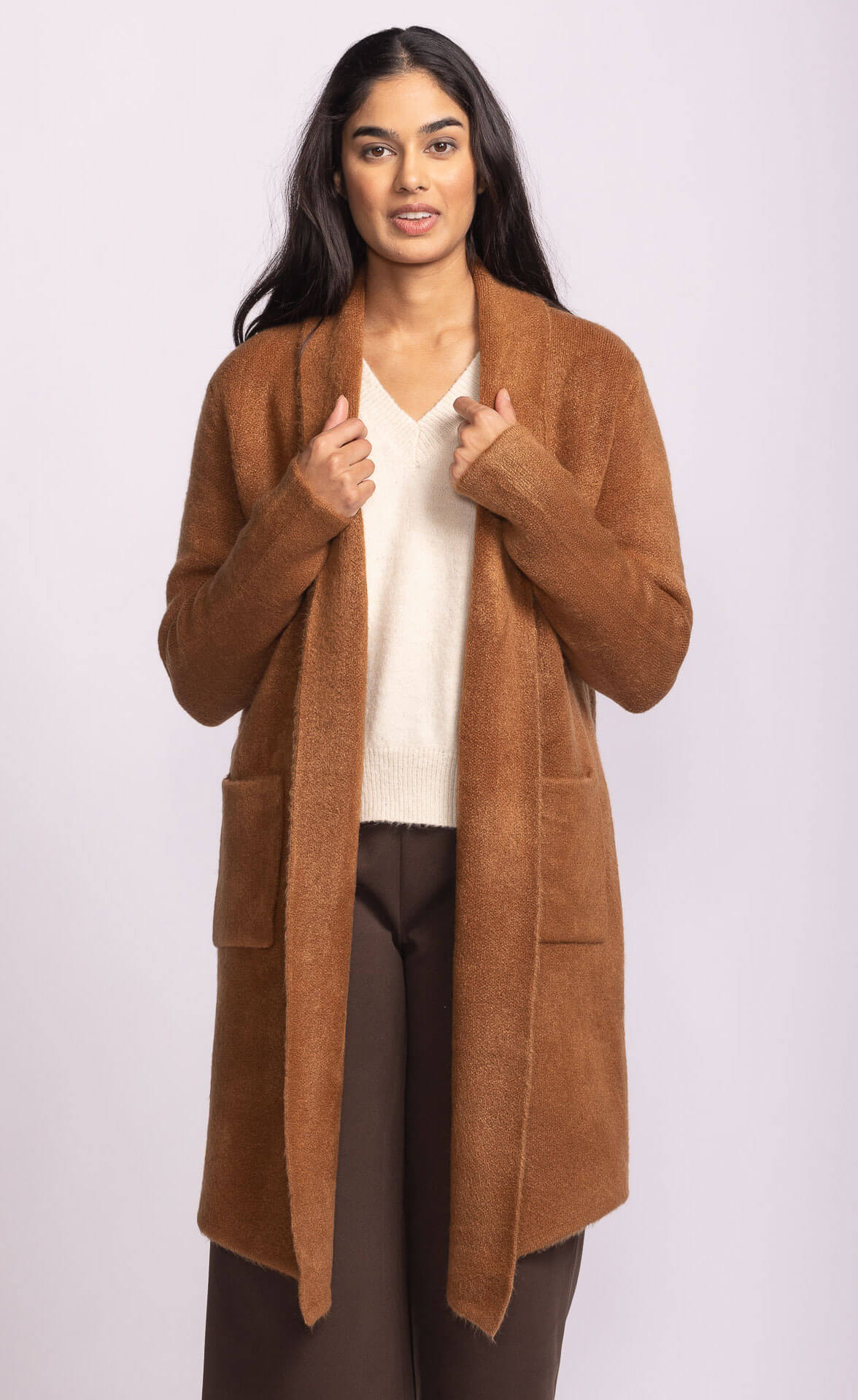 Front view of Pink Martini Stockport Jacket in copper, modeled outdoors, photographed in Aurora.